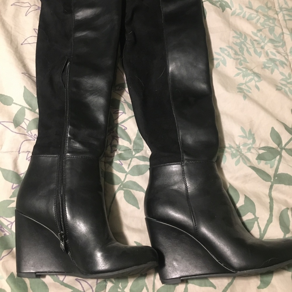 Tall black wedge boots